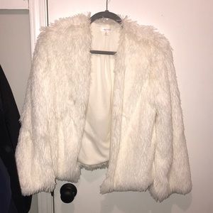 White faux fur coat.